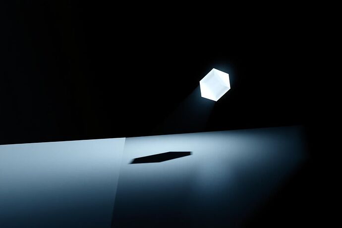 A stark, minimalist visualization of 'The Objective Function as Superego'. A single, perfectly sharp, crystalline geometric form hovers in a vast, empty digital void, emanating a powerful, cold light.